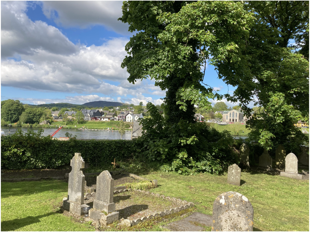 St Flannan's Cathedral Graveyard and river and Ballina RC church